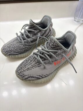 adidas Yeezy Boost 350 V2 'Beluga 2.0'
Kids Gray Knit Sneakers with Red Accent